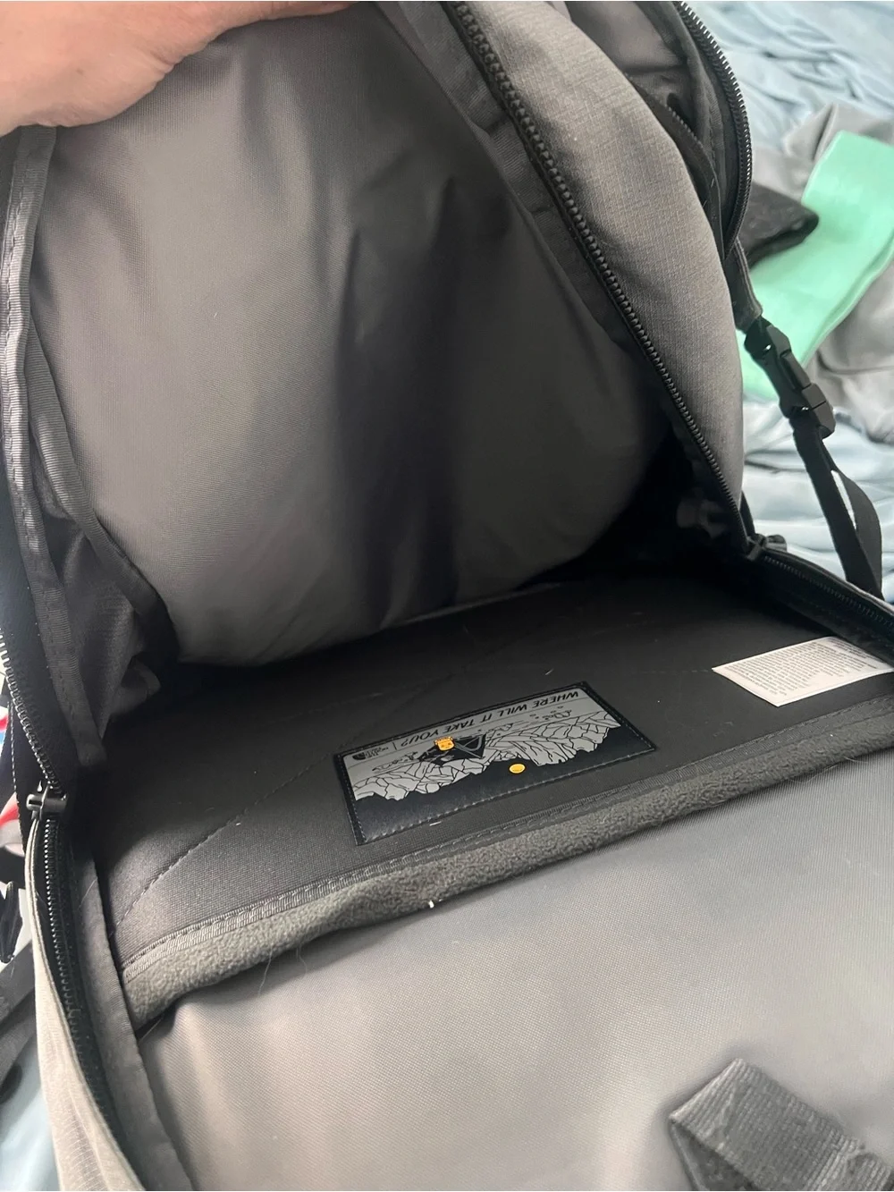 The North Face Generator Backpack in Light Gray and Black with Front Bungee